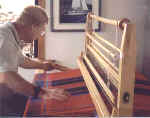 Student weaving his own Scottish tartan at the Estuary Bed and Breakfast.