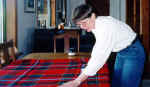 Your teacher, Patricia Magee, carefully checking over a Scottish tartan.