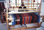 Weaving patterns on a full-sized loom .